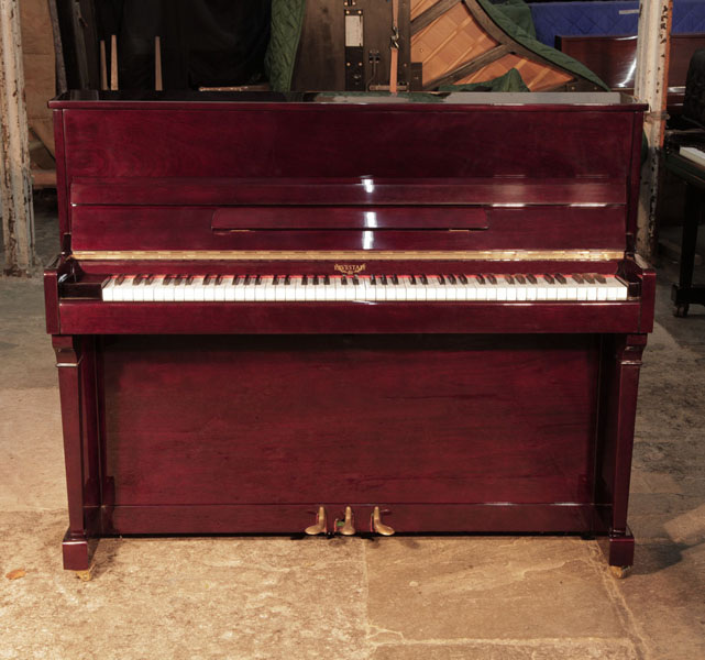 Reconditioned, Eavestaff upright piano for sale with a mahogany case and brass fittings. Piano has an eighty-eight note keyboard and and three pedals. 